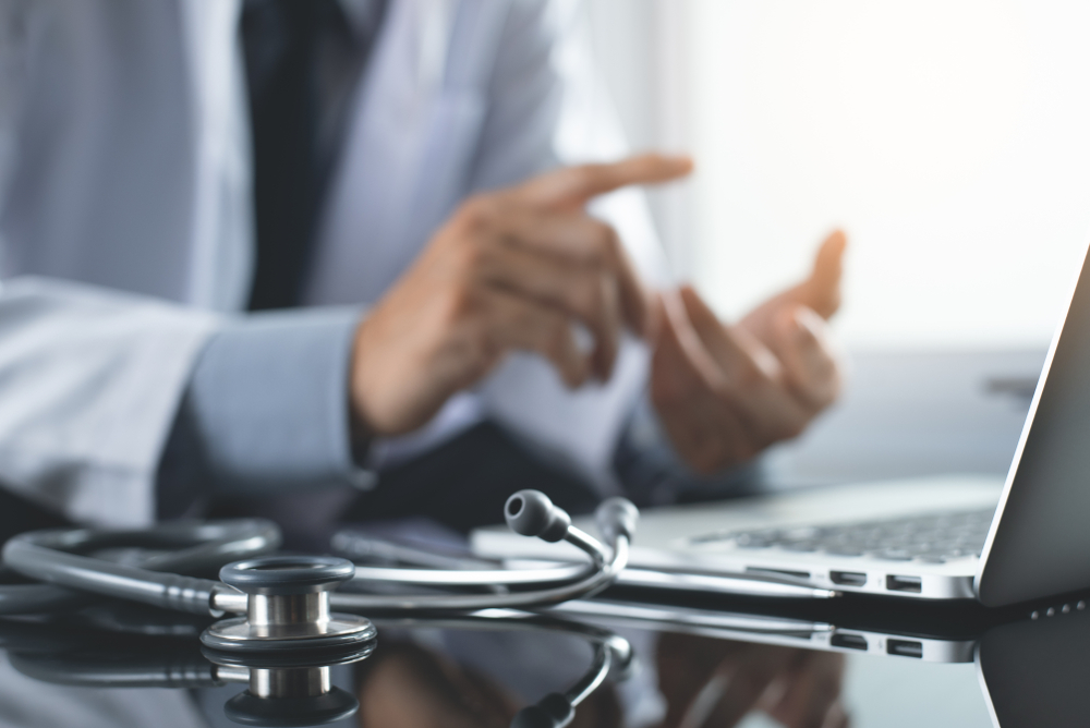 doctor in front of laptop